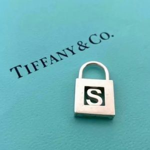 Auth Tiffany & Co. sterling silver padlock pendant with the initial S & chain.